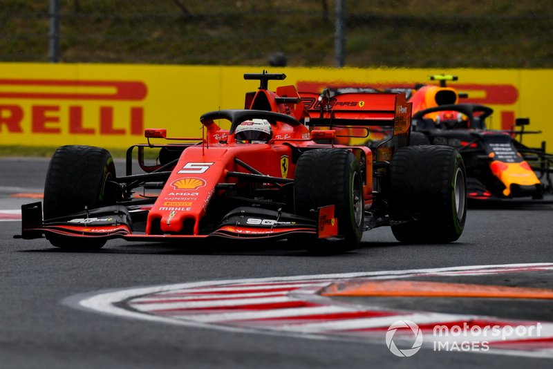 Sebastian Vettel, Ferrari SF90, leads Pierre Gasly, Red Bull Racing RB15
