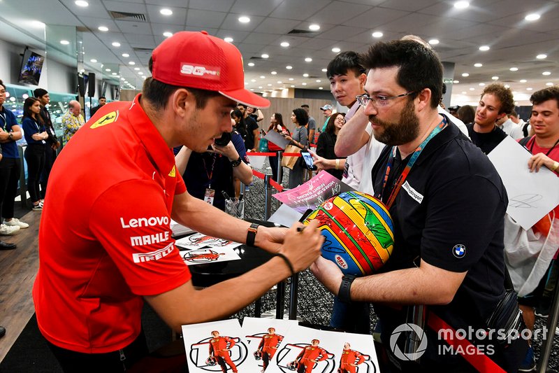Charles Leclerc, Ferrari signs an autograph for a fan