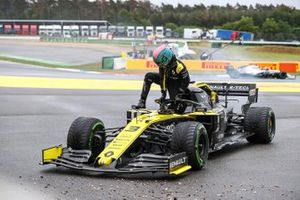 Daniel Ricciardo, Renault F1 Team, climbs out of his car and retires from the race