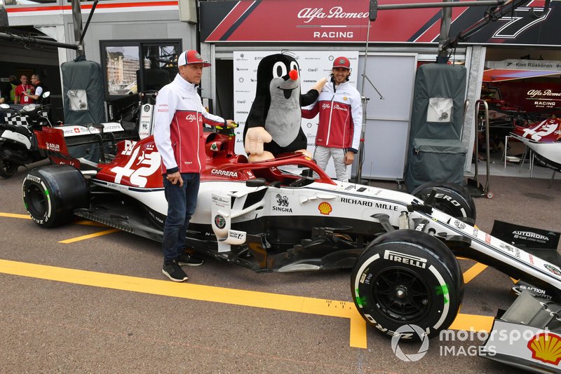 Kimi Raikkonen, Alfa Romeo Racing and Antonio Giovinazzi, Alfa Romeo Racing pose for a photograph with a mole