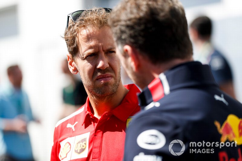 Sebastian Vettel, Ferrari y Christian Horner, Director del equipo, Red Bull Racing