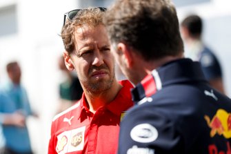 Sebastian Vettel, Ferrari e Christian Horner, Team Principal, Red Bull Racing