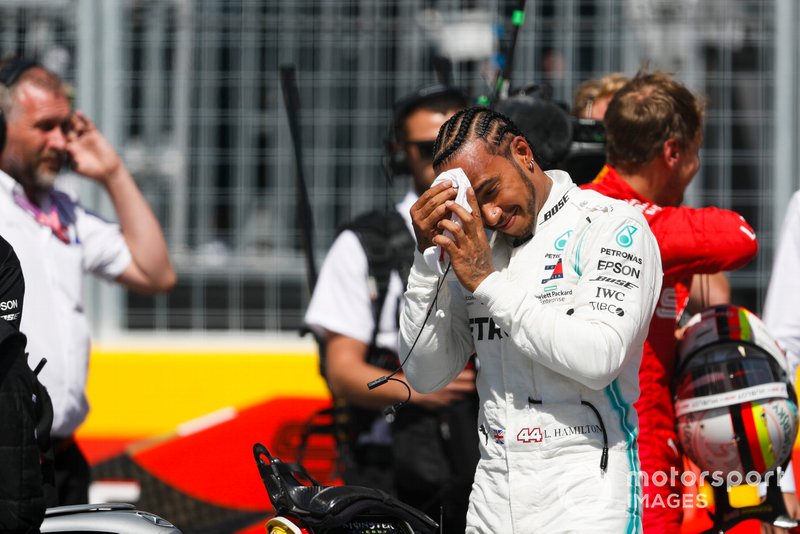 Lewis Hamilton, Mercedes AMG F1, and pole man Sebastian Vettel, Ferrari, after Qualifying