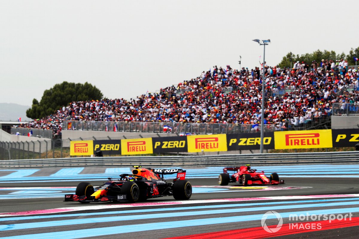 Sergio Perez, Red Bull Racing RB16B, leads Carlos Sainz, Ferrari SF21