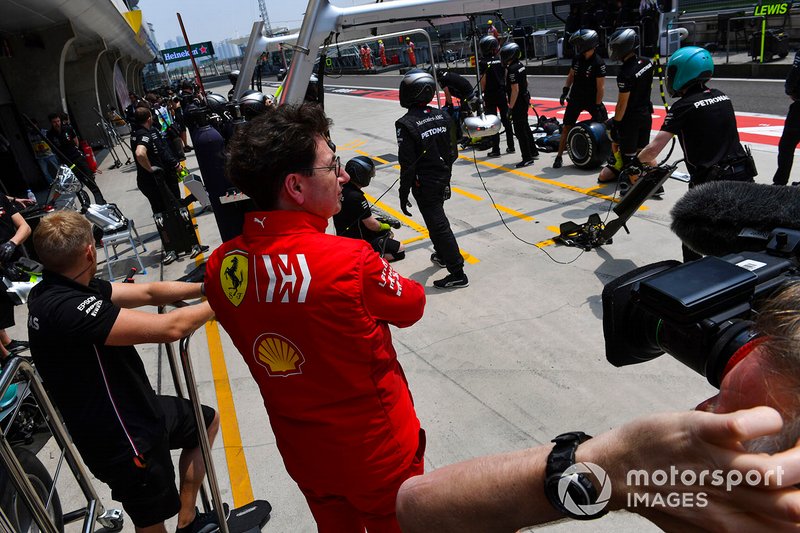 Mattia Binotto, Team Principal Ferrari, watches as Mercedes make a pit stop during practice with Valtteri Bottas, Mercedes AMG W10