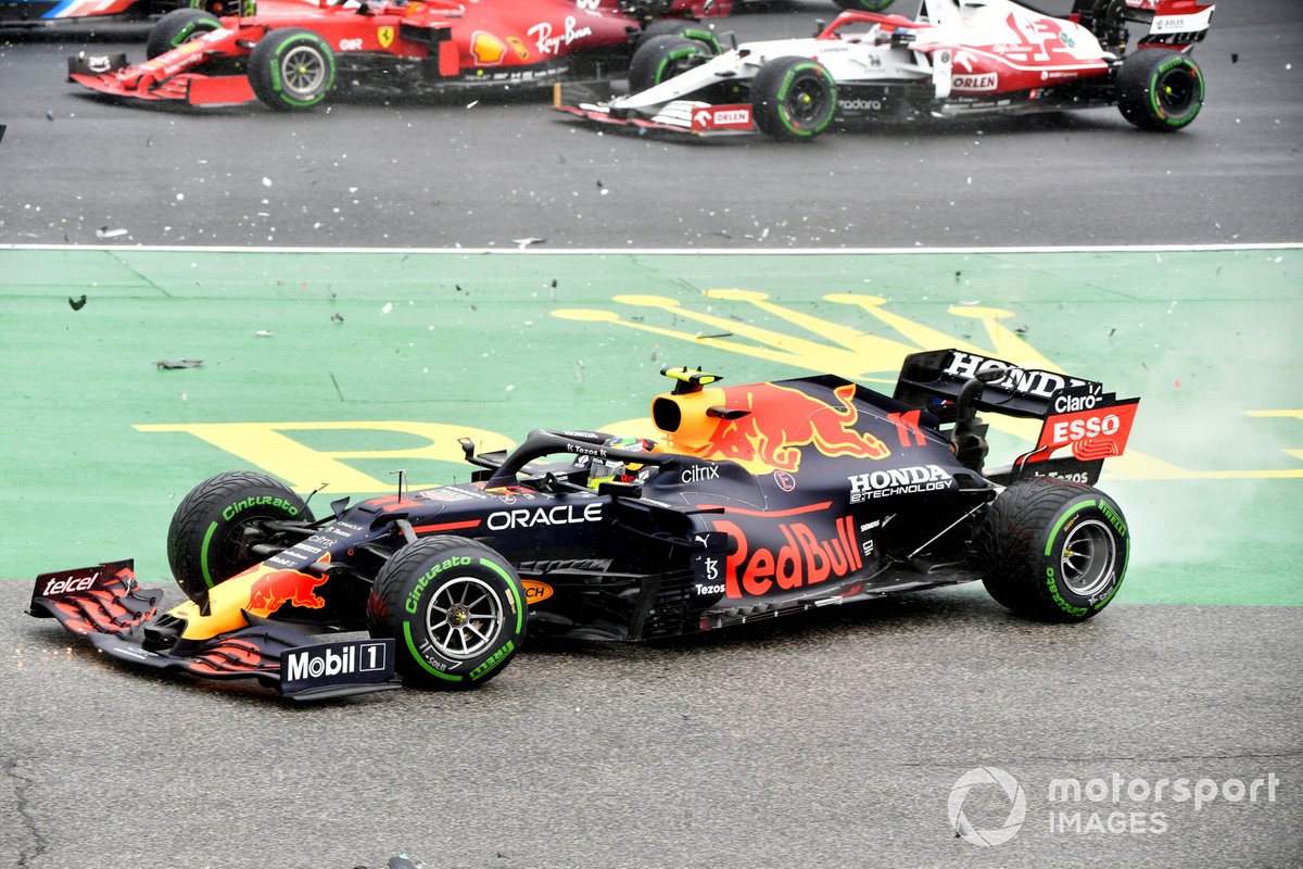 Sergio Perez, Red Bull Racing RB16B, crashes out at the start