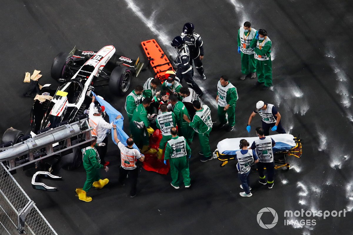 Theo Pourchaire, ART Grand Prix raises his thumb as medical personnel lift him on to a stretcher