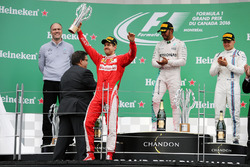 The podium (L to R): Sebastian Vettel, Ferrari, second; Lewis Hamilton, Mercedes AMG F1, race winner; Valtteri Bottas, Williams, third