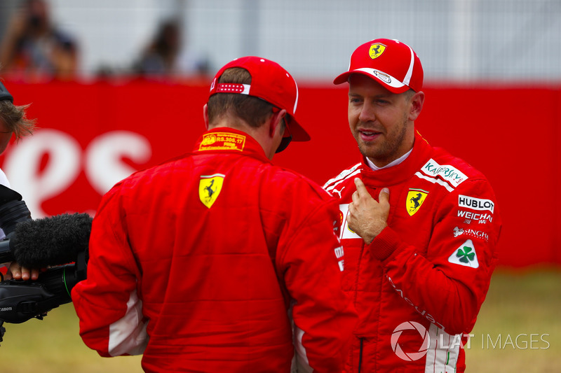 Kimi Raikkonen, Ferrari, and pole sitter Sebastian Vettel, Ferrari