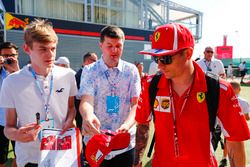 Kimi Raikkonen, Ferrari, signs autographs for fans