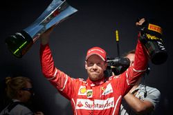 Race winner Sebastian Vettel, Ferrari and Champagne bottle