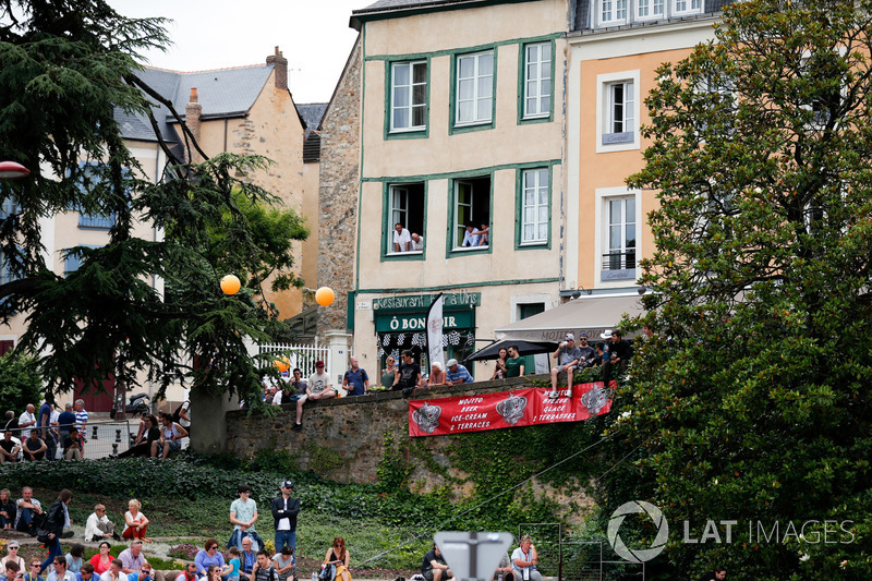 Fans watch the parade out of the windows