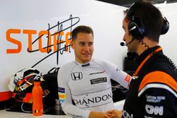 Stoffel Vandoorne, McLaren, talks to his engineer in the pit garage