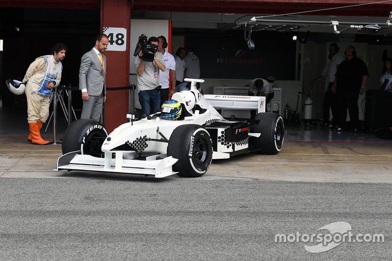 Zsolt Baumgartner, F1 Experiences 2-Seater driver and F1 Experiences 2-Seater passenger Thomas Senecal, Journalist and Presenter for Canal