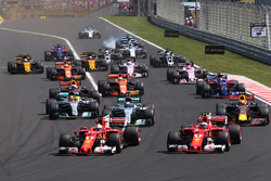 Sebastian Vettel, Ferrari SF70H, leads, Kimi Raikkonen, Ferrari SF70H at the start of the race