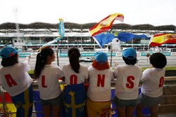 Lewis Hamilton, Mercedes AMG F1 W08, passes a group of Fernando Alonso, McLaren, fans