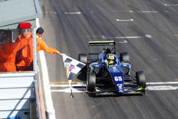 Checkered flag for Enaam Ahmed, Carlin