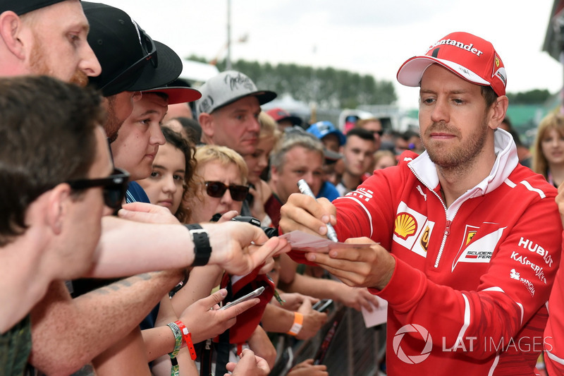 Sebastian Vettel, Ferrari signs autographs for the fans at the autograph session