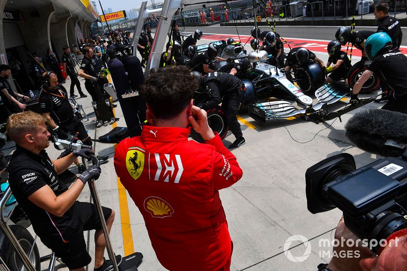 Mattia Binotto, Team Principal Ferrari, watches as Mercedes make a pit stop during practice with Valtteri Bottas, Mercedes AMG W10