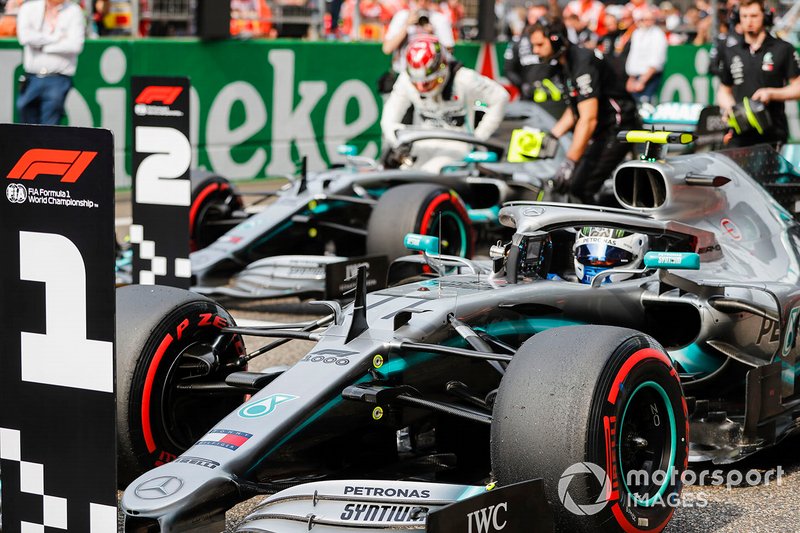 Front row starters, Lewis Hamilton, Mercedes AMG F1, and pole man Valtteri Bottas, Mercedes AMG F1, arrive on the grid after Qualifying