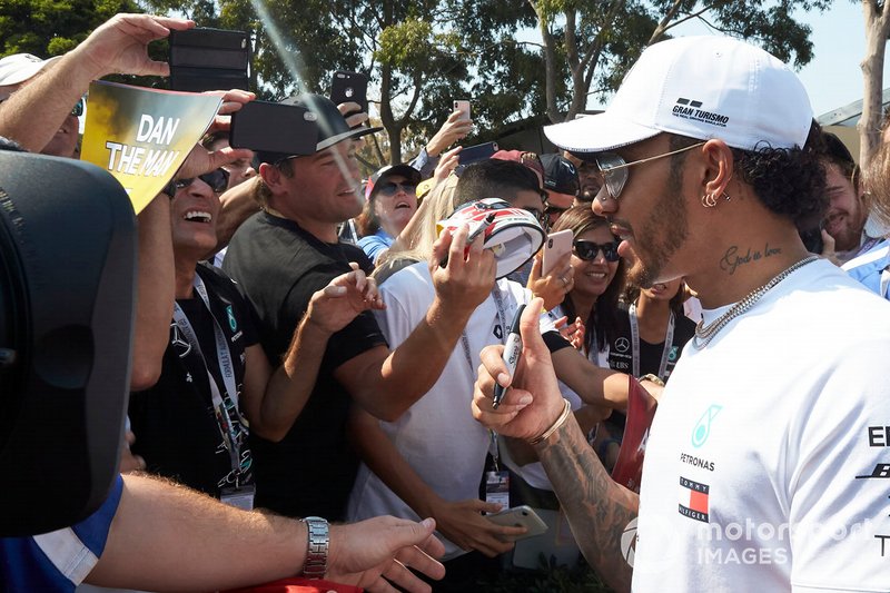 Lewis Hamilton, Mercedes AMG F1, signs autographs for fans
