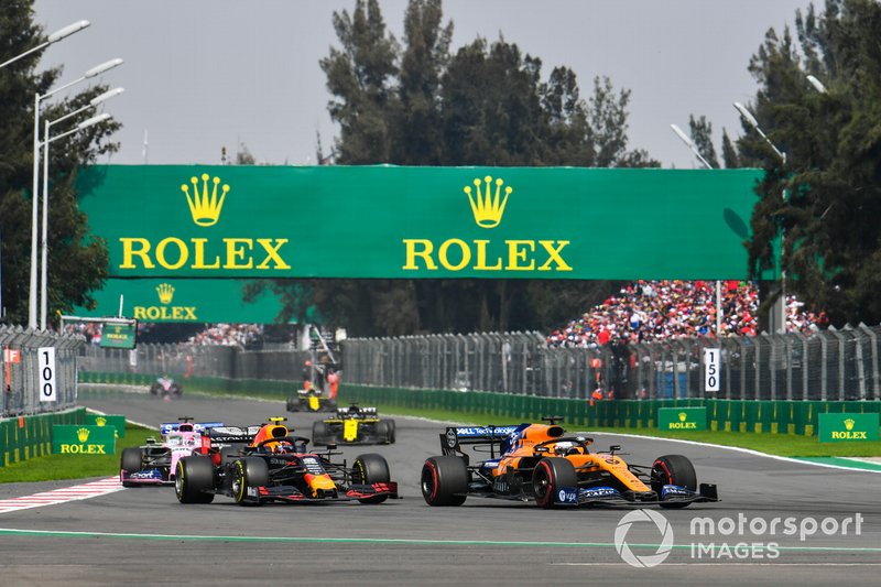 Carlos Sainz Jr., McLaren MCL34, leads Max Verstappen, Red Bull Racing RB15, and Sergio Perez, Racing Point RP19