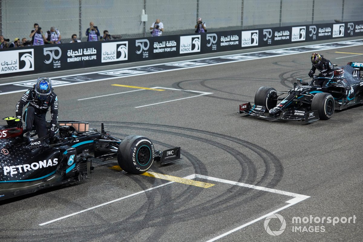 Valtteri Bottas, Mercedes F1 W11, 2nd position, and Lewis Hamilton, Mercedes F1 W11, 3rd position, on the grid after the celebratory donuts