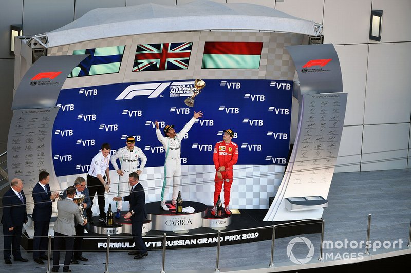 Fred Judd, Chief Engineer Trackside, Mercedes AMG F1, Valtteri Bottas, Mercedes AMG F1, 2nd position, Lewis Hamilton, Mercedes AMG F1, 1st position, and Charles Leclerc, Ferrari, 3rd position, on the podium