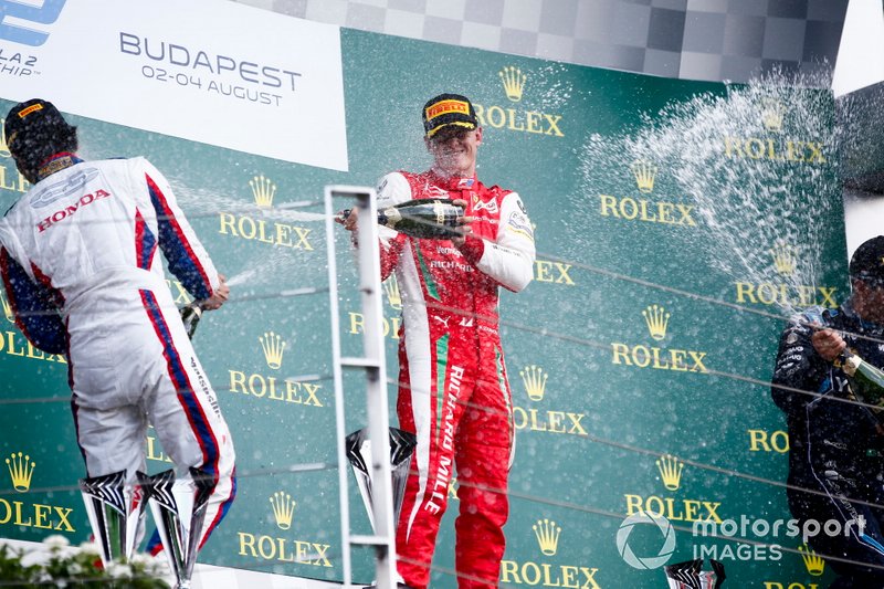 Nobuharu Matsushita, Carlin, Race winner Mick Schumacher, Prema Racing and Sergio Sette Camara, Dams celebrate on the podium with the champagne