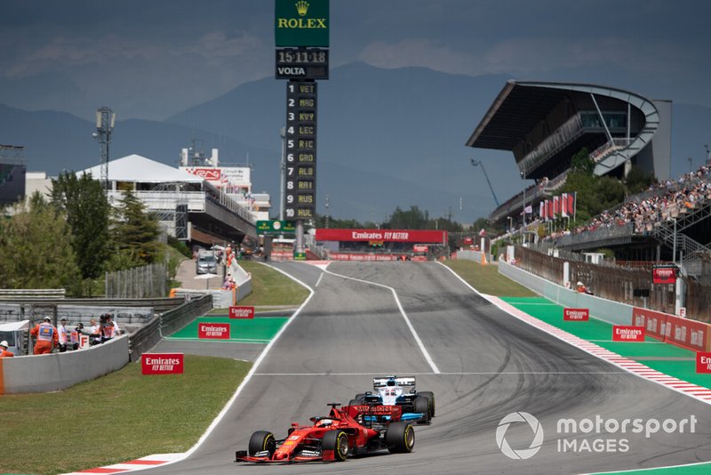 Sebastian Vettel, Ferrari SF90, leads George Russell, Williams Racing FW42