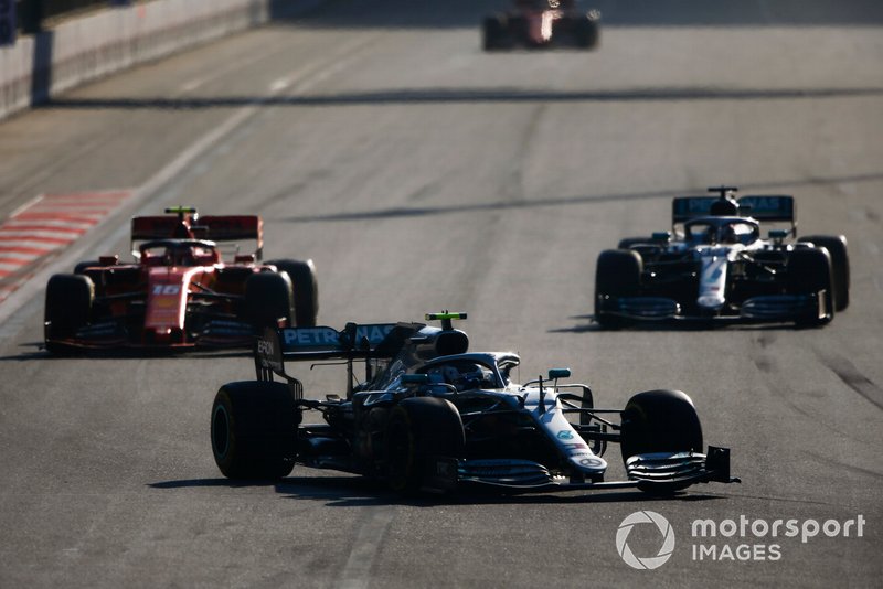 Valtteri Bottas, Mercedes AMG W10, leads Charles Leclerc, Ferrari SF90, and Lewis Hamilton, Mercedes AMG F1 W10