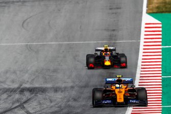Carlos Sainz Jr., McLaren MCL34, leads Pierre Gasly, Red Bull Racing RB15