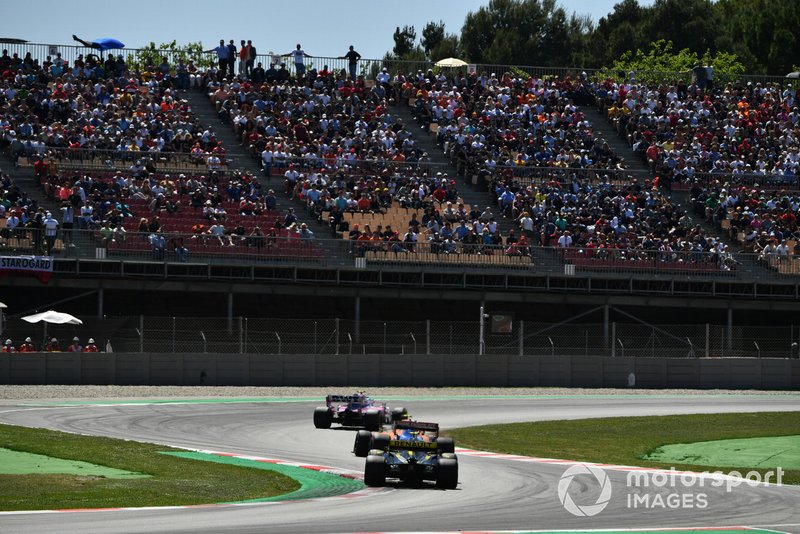 Lance Stroll, Racing Point RP19, leads Lando Norris, McLaren MCL34, and Nico Hulkenberg, Renault R.S. 19