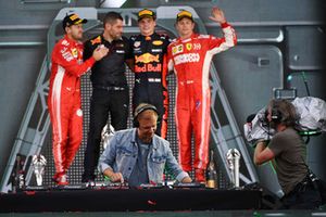 (L to R): Sebastian Vettel, Ferrari, Guillaume Rocquelin, Red Bull Racing Race Engineer, Max Verstappen, Red Bull Racing and Kimi Raikkonen, Ferrari celebrate on the podium and Armin van Buuren, DJ 