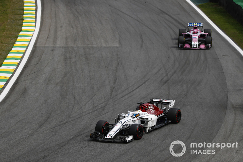 Marcus Ericsson, Sauber C37, leads Esteban Ocon, Racing Point Force India VJM11