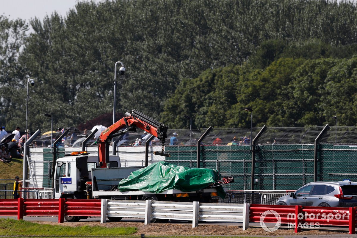 The car of Max Verstappen, Red Bull Racing RB16B, is returned to the garage on a truck