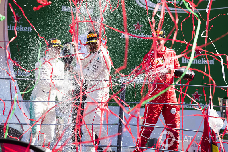 Second place Valtteri Bottas, Mercedes AMG F1, Race winner Third place Lewis Hamilton, Mercedes AMG F1 Sebastian Vettel, Ferrari, celebrate, Champagne on the podium