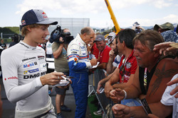 Brendon Hartley and Hans-Joachim Stuck sign autographs