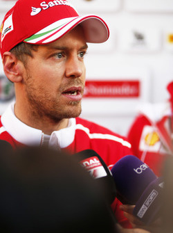 Sebastian Vettel, Ferrari, talks to the media