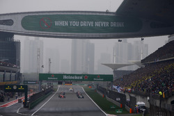 Lewis Hamilton, Mercedes AMG F1 W08, and Sebastian Vettel, Ferrari SF70H, at the start