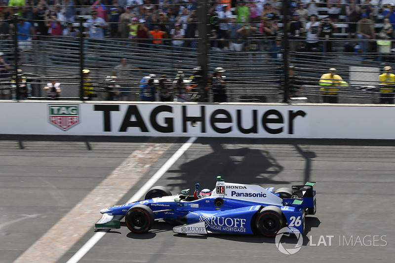 Takuma Sato, Andretti Autosport Honda crosses the finish line and the yard of bricks under the checkered flag for the win