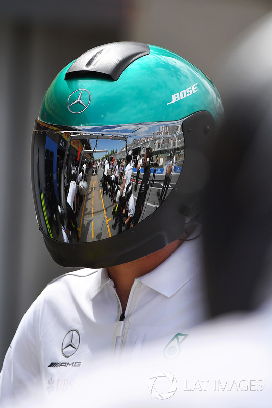 Mercedes AMG F1 mechanic with reflection in helmet
