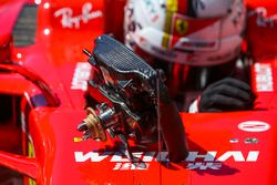 Race winner Sebastian Vettel, Ferrari, climbs out of his car in Parc Ferme