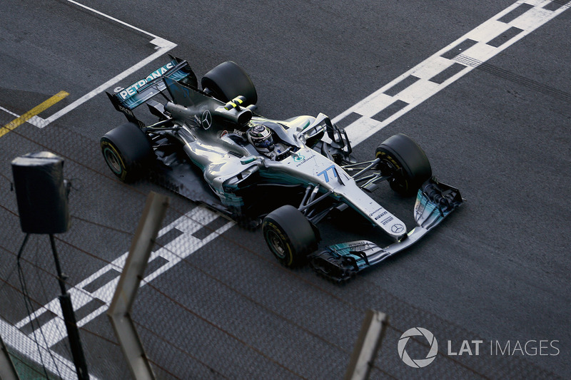 Valtteri Bottas, Mercedes-Benz F1 W08 crosses the line to take the chequered flag and Second place