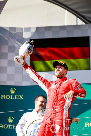 Sebastian Vettel, Ferrari, 2nd position, with his trophy on the podium