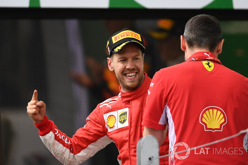 Race winner Sebastian Vettel, Ferrari celebrates on the podium