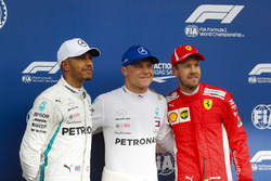Pole sitter Valtteri Bottas, Mercedes AMG F1, poses with second place Lewis Hamilton, Mercedes AMG F1, and third place Sebastian Vettel, Ferrari