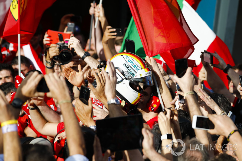 Race winner Sebastian Vettel, Ferrari, celebrates on arrival in Parc Ferme with his team