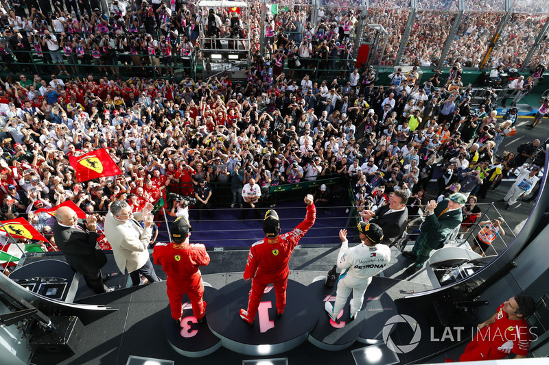 Race winner Sebastian Vettel, Ferrari, second place Lewis Hamilton, Mercedes AMG F1, third place, Ki