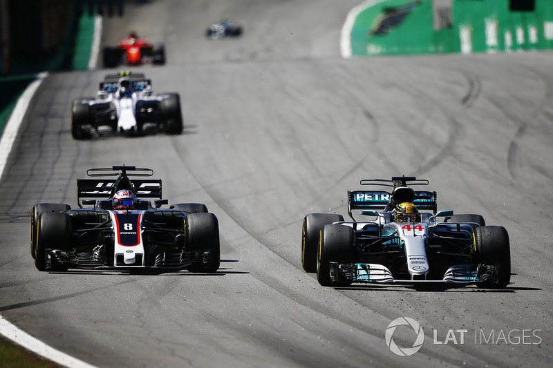 Lewis Hamilton, Mercedes AMG F1 W08, passes Romain Grosjean, Haas F1 Team VF-17